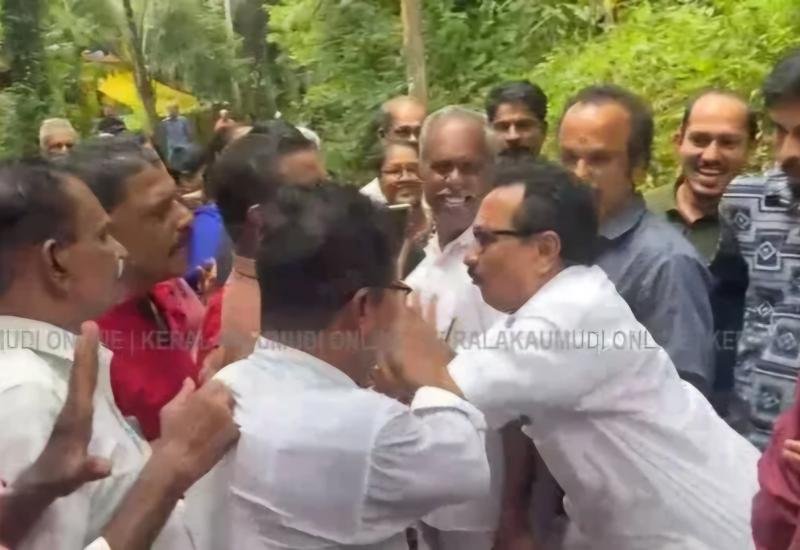 K P Mohanan pushing through the crowd